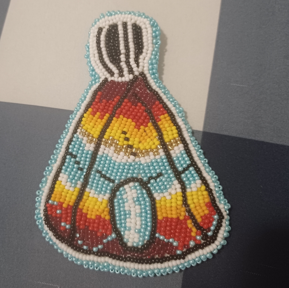 Flat beaded medallion teepee